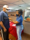 Yolandea Wood measures a fellow Veteran for a suit.